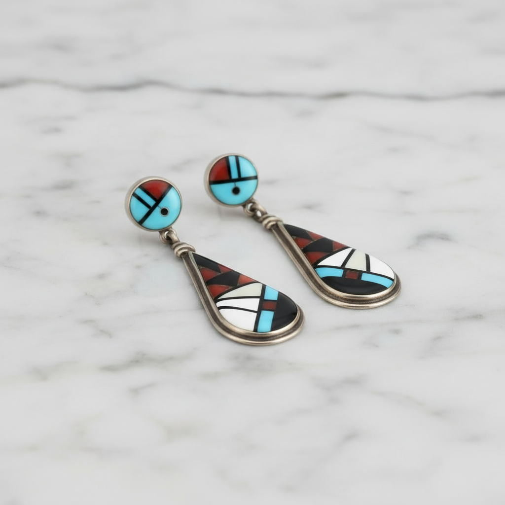 Pair of earrings with geometric design on a white background