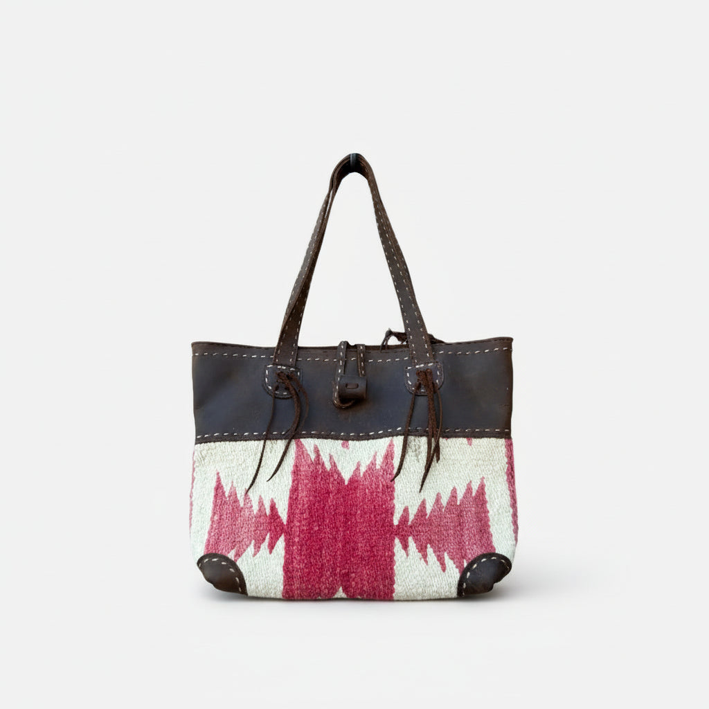 Handbag with a patterned design on a white background