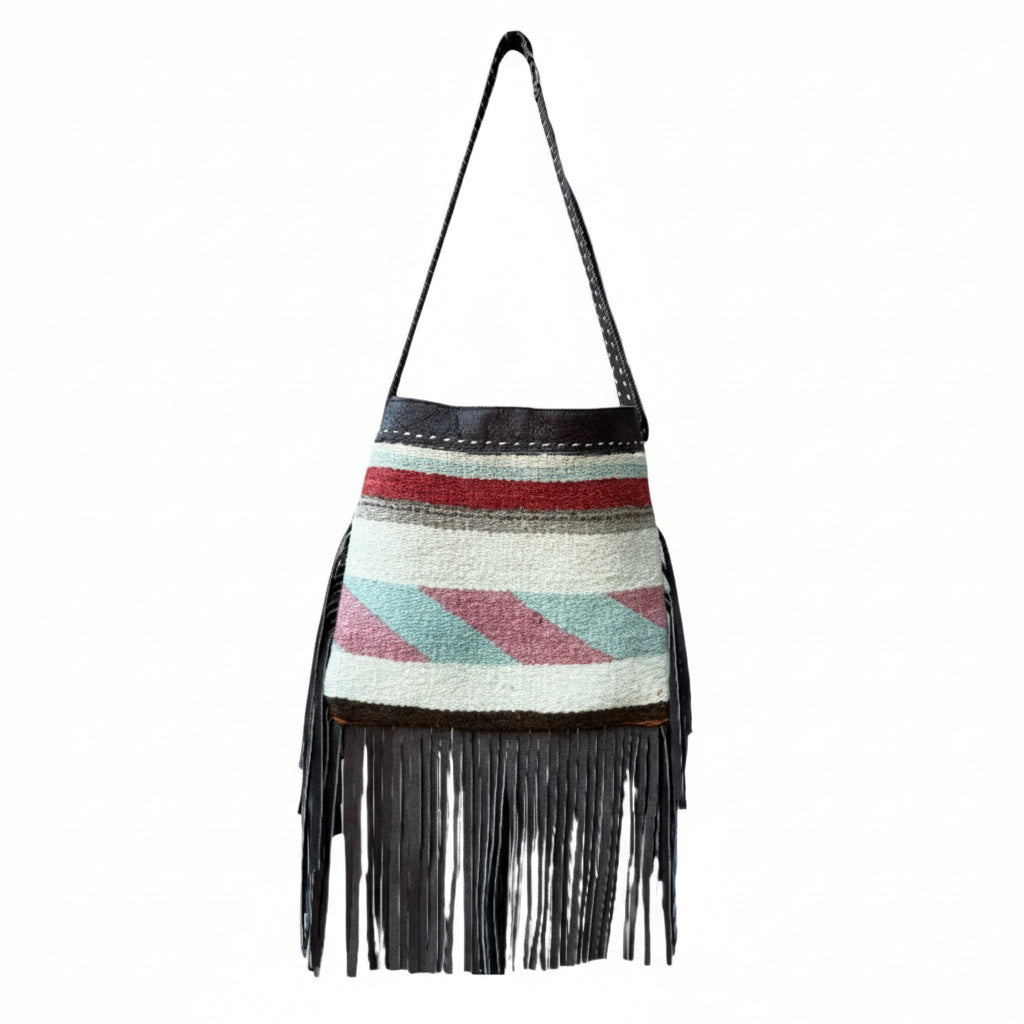 Multicolored woven bag with fringe on a white background
