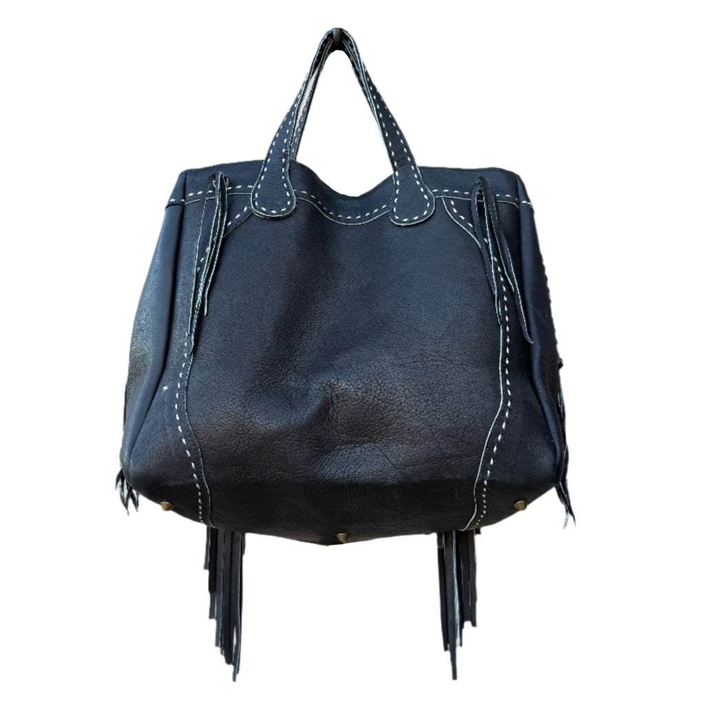 Black leather handbag with fringe details on