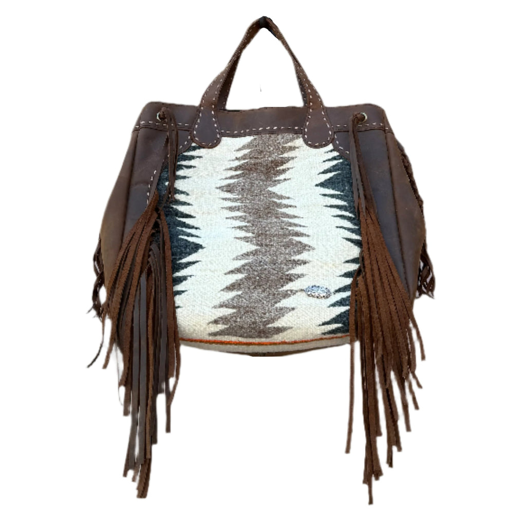 Handbag with fringes and patterned design on a white background