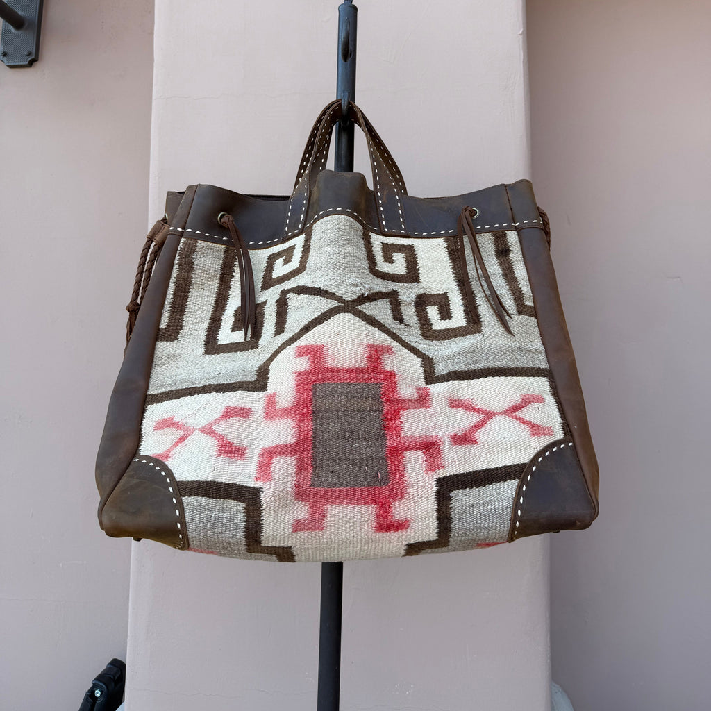 Handbag with geometric pattern on a white surface