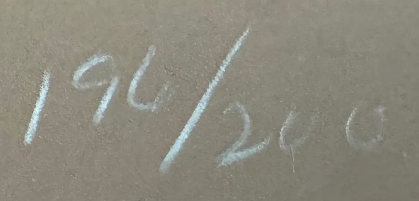 Handwritten numbers '196/200' on a textured surface