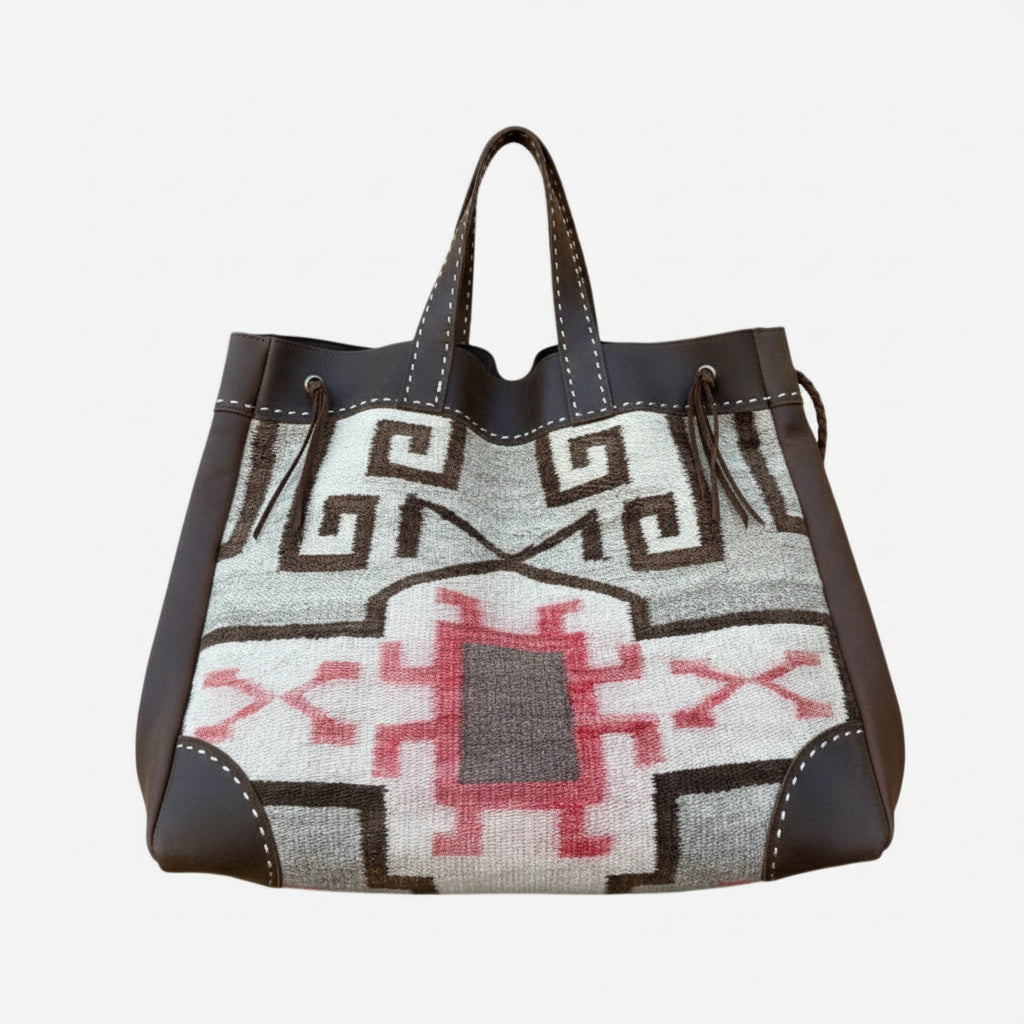 Handbag with geometric pattern on a white background